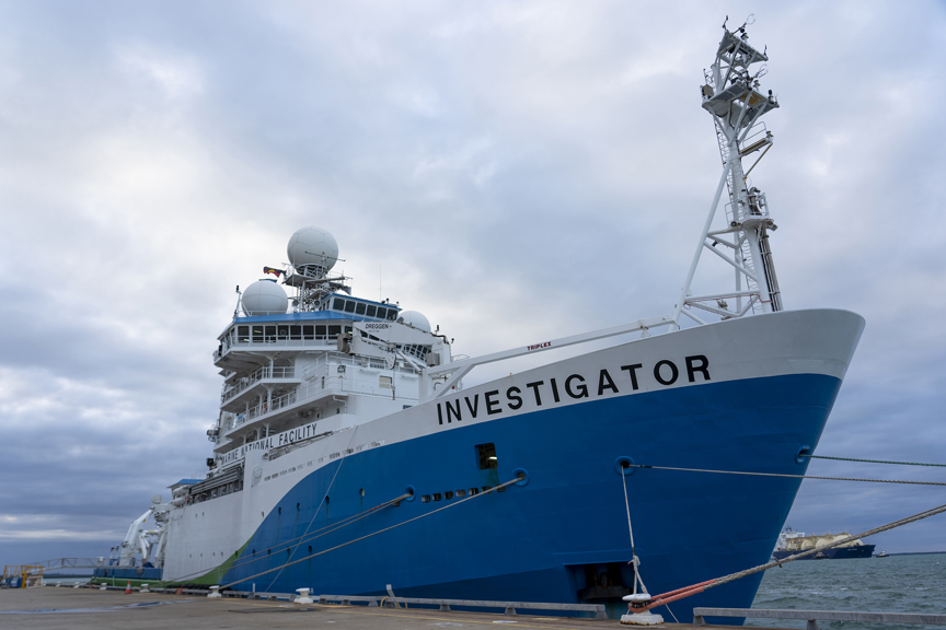 A large research ship sits at a dock in Darwin