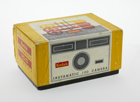 Yellow camera box with a graphic illustration of the camera on the box