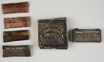 6 paper object. 3 are small cardboard boxes