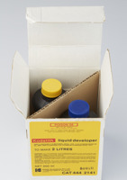 An open box shows two bottles inside