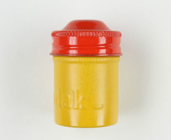 Small yellow metal round canister with a red lid