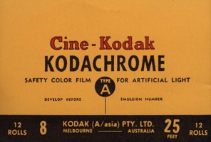 Small colour printed label. Yellow and black background with black, red and yellow text.