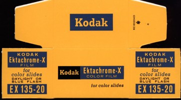 Flat, unused cardboard box printed in yellow, black and blue colour scheme.