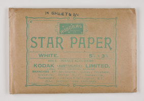 Rectangular brown paper envelope with green printed text.