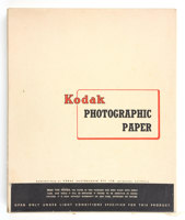 White rectangular box with red and black print on the the lid