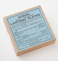 Cardboard box with a blue label with black print