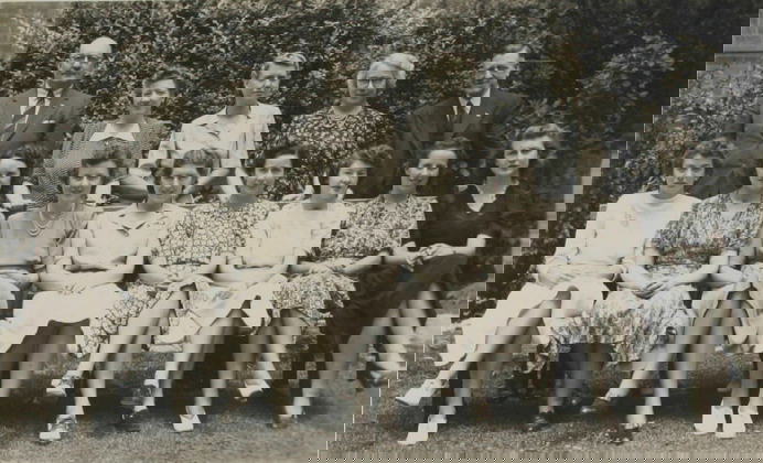 Group portrait of two men and  12 womem