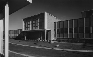 Black and white image of a large factory building