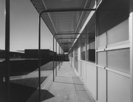 Black and white image of a building looking from the side