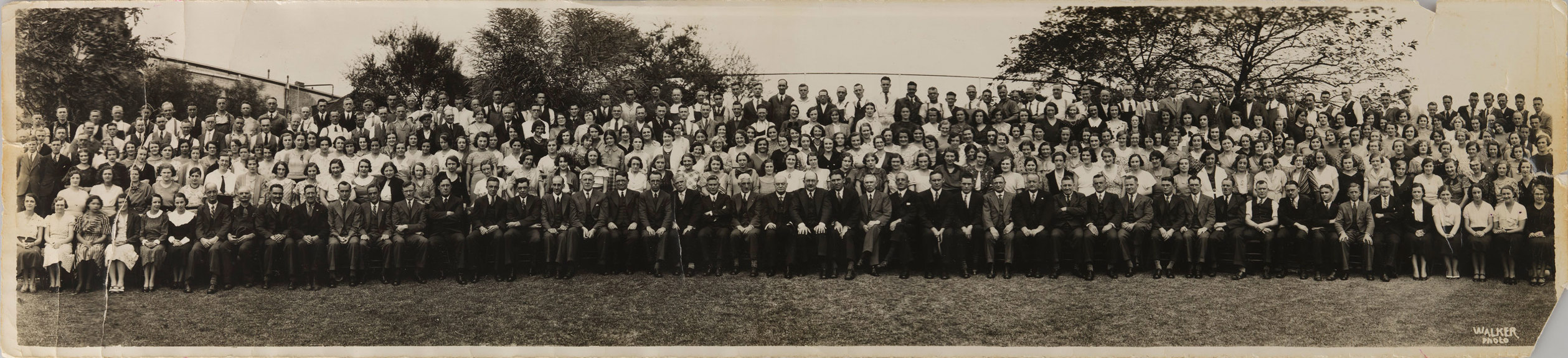 Hundreds of people sitting and standing