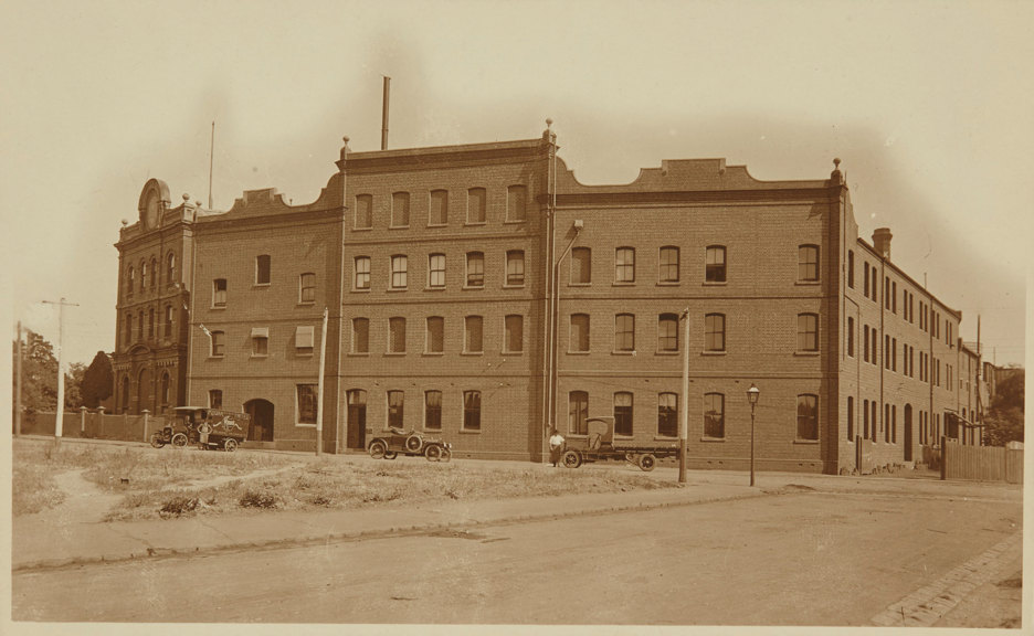 Delivery trucks infront of brick building