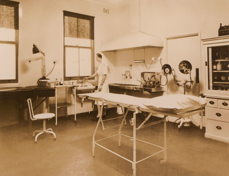 Examination table surrounded by medical equipment