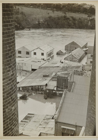 Elevated view of buildings partially submerged in flood waters
