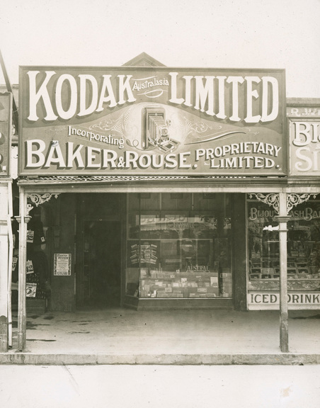 Shopfront with large billboard on top of awning