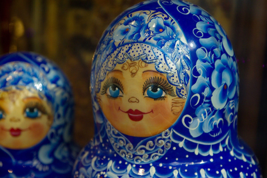 Detail of the heads of Matryoshka dolls painted blue and white