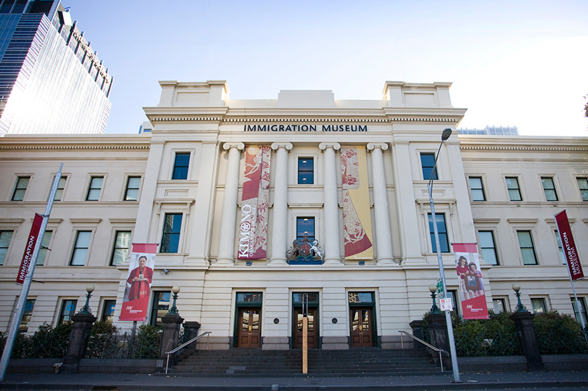 External view of Immigration Museum from Flinders Street in early evening.