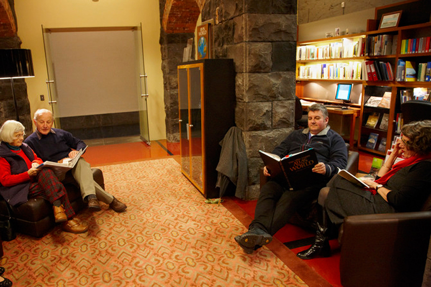 People sitting down and using redeveloped Immigration Discovery Centre.