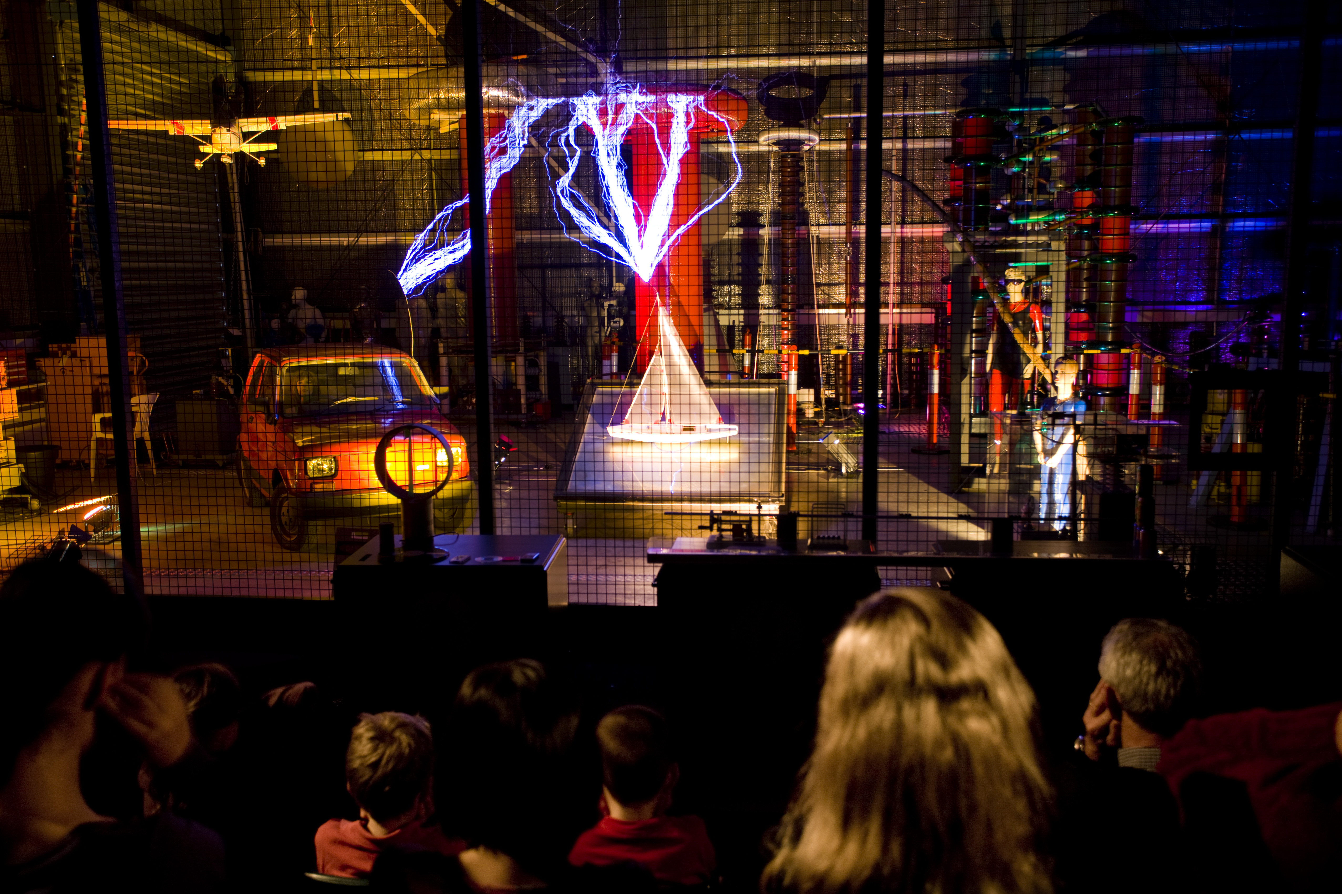 Audience watching a science show about electricity
