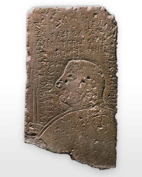 Carved stone with profile of warrior