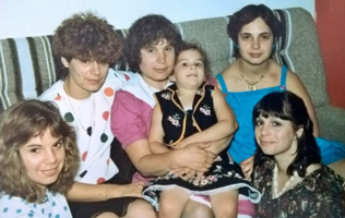 People of saying ages sitting on couch