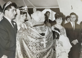 Bride drinking from cup held by priest.