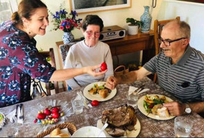 Family eating lunch and exchanging easter eggs