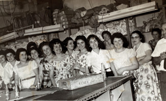 A group of women take a break at a clothing factory