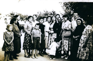 Group of people of varying ages posed for photograph.