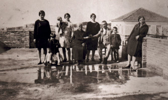 Nine people of varying ages posed for a photo.