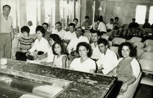 A small group of people sitting in chairs