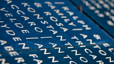 The memorial wall in the Tribute Garden at Immigration Museum. 