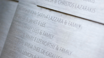 The memorial wall in the Tribute Garden at Immigration Museum. 