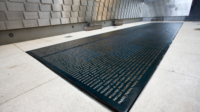 The memorial wall in the Tribute Garden at Immigration Museum. 
