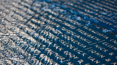 The memorial wall in the Tribute Garden at Immigration Museum. 