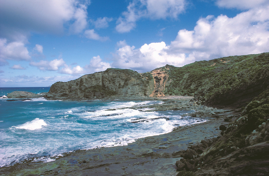 A rocky cliff next to the ocean