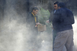 Three men during the repatriation ceremony