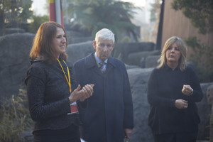 Three people standing in a group