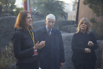 Three people standing in a group