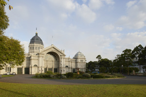The Royal Exhibition Building’s eastern side, with the dome visible in the background and a green lawn in the foreground. 