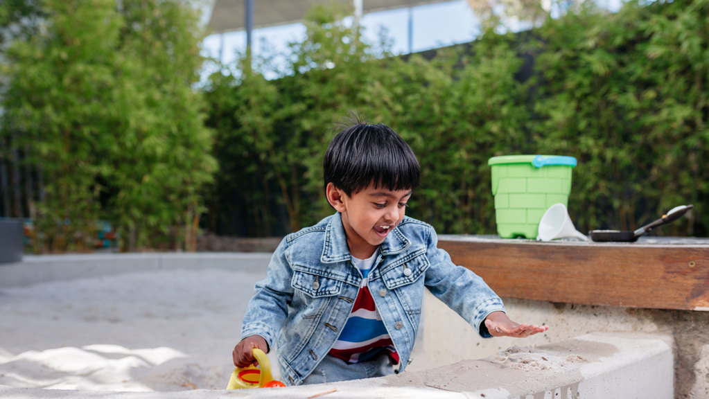 Child playing in a sandpit