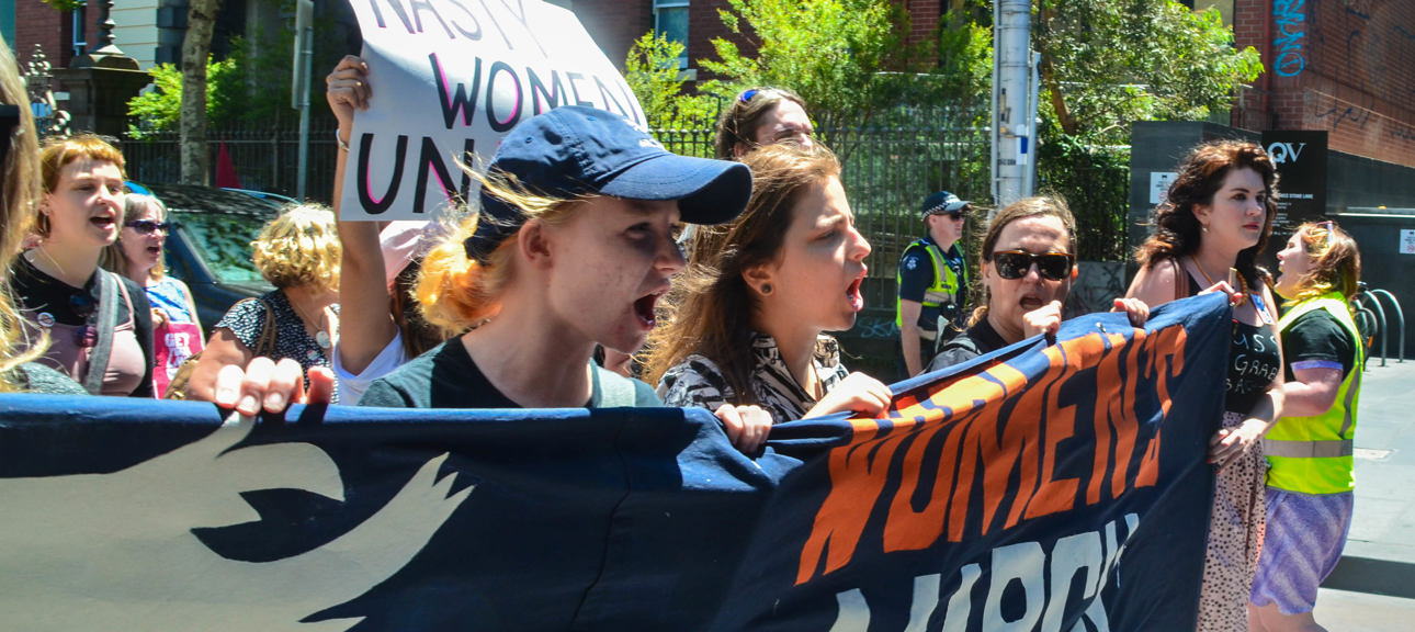 Group of women holding a protest banner