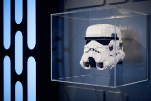 A stormtrooper helmet made of lego in a display case in LEGO® Star Wars: The Exhibition at Melbourne Museum.