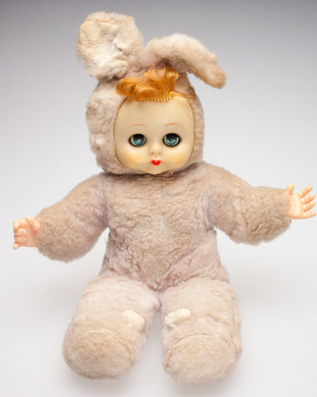 Doll with plastic face