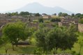 View over city looking towards Vesuvius, gardens in foreground