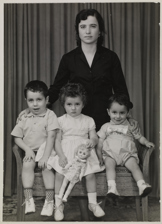 Portrait of a mother with her three children, ca. late 1960.