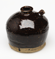 Glazed ceramic soy sauce jar.