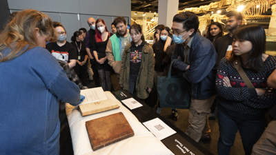 People learning about rare books at Melbourne Museum