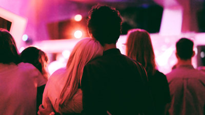 Couple watching musical performance during the Nocturnal late night opening at Melbourne Museum, March 2018