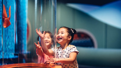 Two children using a butterfly interactive
