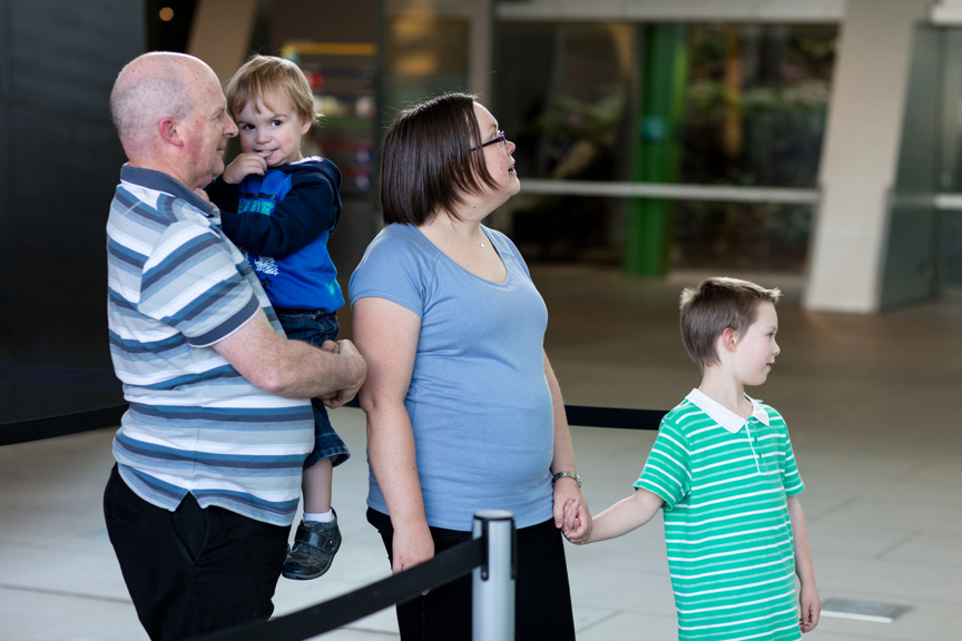 Family waiting in line to purchase tickets to enter the Melbourne Museum